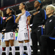Megan Rapinoe takes a knee before a match in 2016.